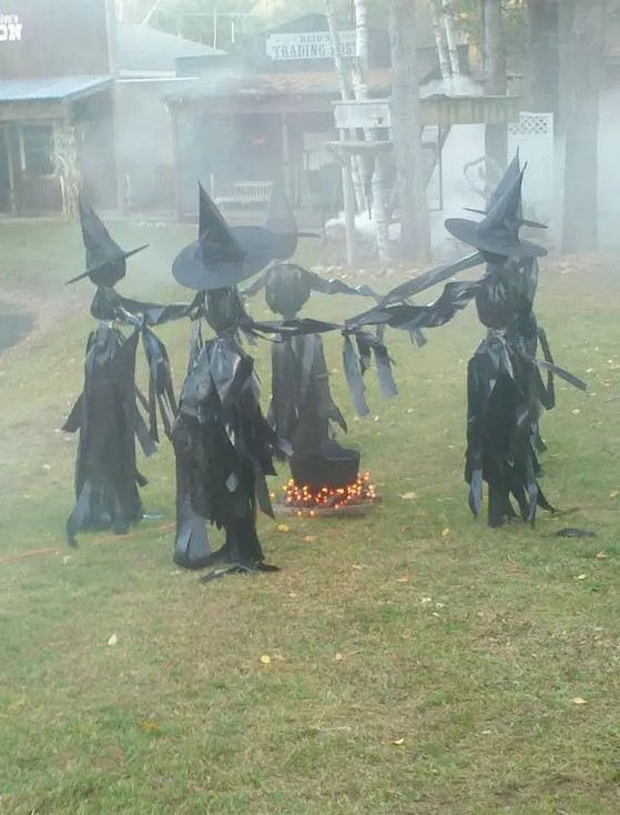 a witches' circle around a cauldron with lights will look much scarier in the dark