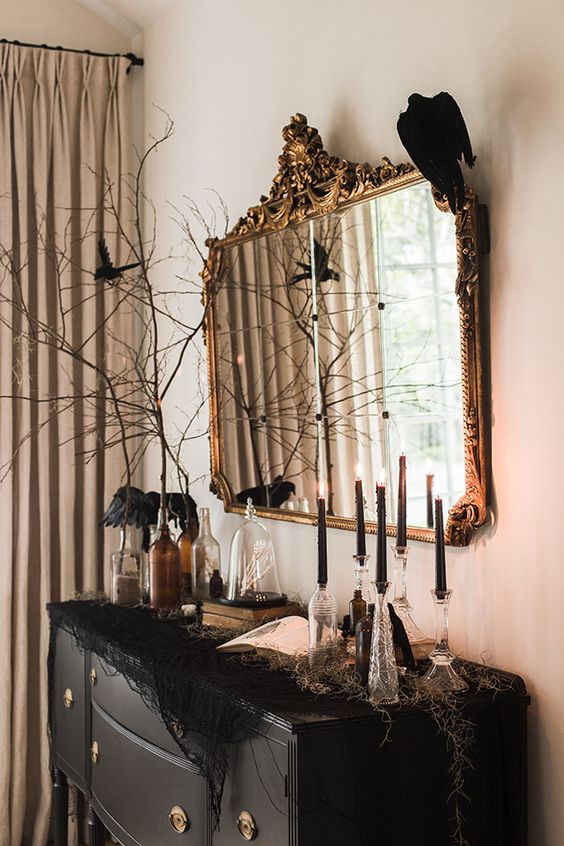 attach a single faux blackbird to the mirror to make it feel like Halloween, it will be fast and easy