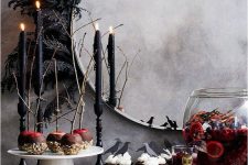 beautiful and easy black feather mirror decor will instantly make it feel like Halloween, and when the holiday is over, you can remove the decor