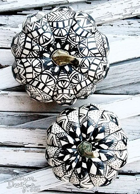 beautiful white pumpkins with black mandalas drawn with a sharpie on them are amazing for boho Halloween decor
