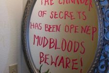 decorate your mirror with a scary inscription done with a lipstick or just a sharpie, and after Halloween just wipe it off