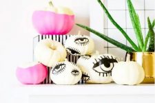 hot pink color block and eye pumpkins can be made with paint and a sharpie easily for a modern Halloween party