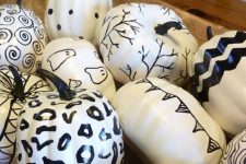 lovely black and white Halloween pumpkins with leopard prints, swirls, bats and spiders all drawn with a sharpie