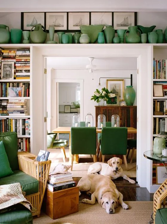open shelves around the doorway and a long shelf over it are used to display vases and books is a cool idea to incorporate a touch of color and store things
