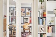 open shelves surrounding the doorway and showing off books, potted plants and artworks is a very cool idea to rock