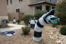 outdoor Halloween decor with a Beetlejuice snake is a super cool and fun idea for your yard