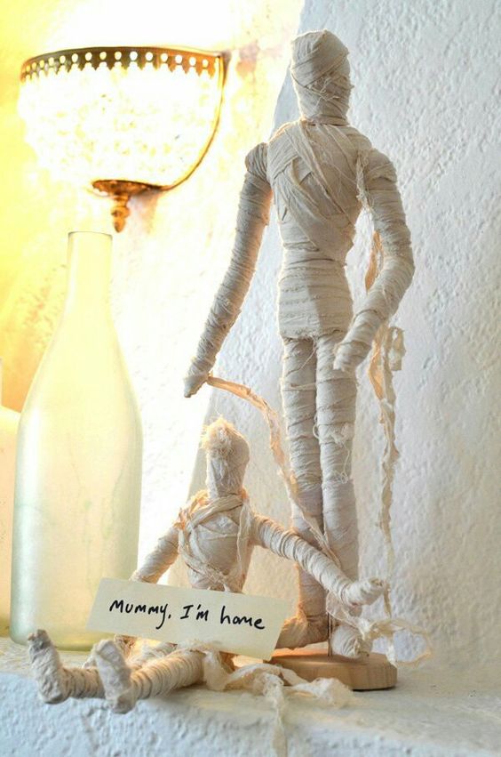 simple and pretty Halloween mummy decor is easy to make and it looks quite cool