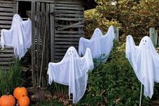 such funny ghosts of cheesecloth and coat hangers won’t scary anyone but will be proper decor
