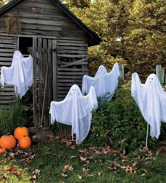 such funny ghosts of cheesecloth and coat hangers won't scary anyone but will be proper decor