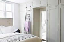 wardrobes taking a whole doorway wall are a sleek and cool storage solution for a bedroom and they brilliantly declutter and save the space