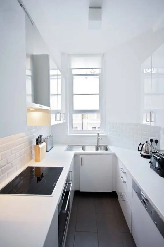 white is ideal for a long and narrow kitchen to make it look larger and airier, rock everything white to visually extend the space