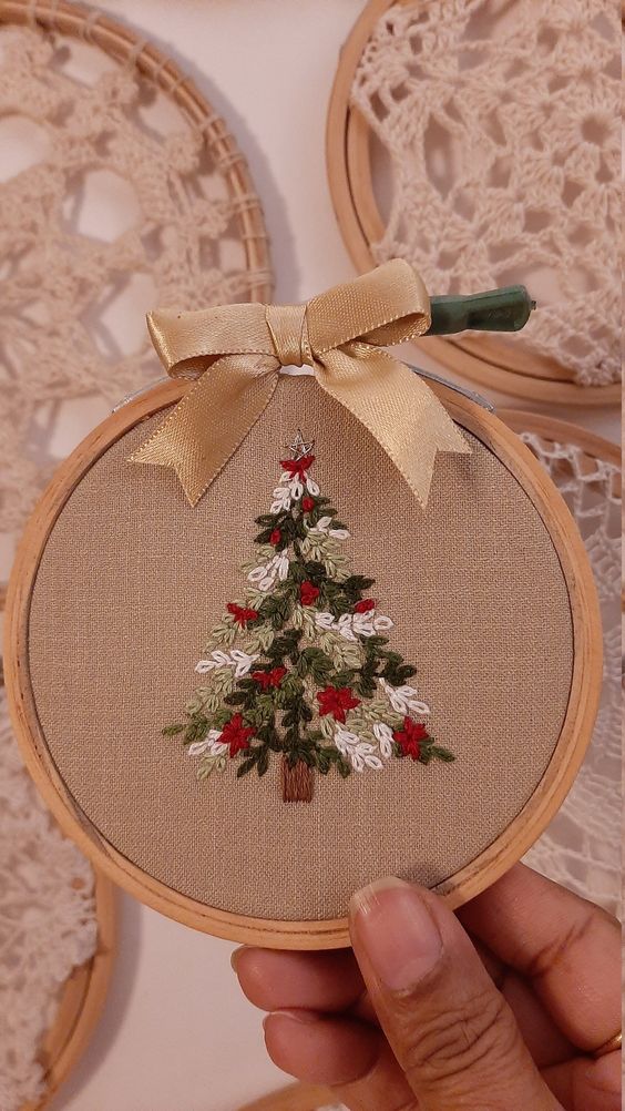 a Christmas ornament of an embroidery hoop with a Christmas tree embroidered is a beautiful solution