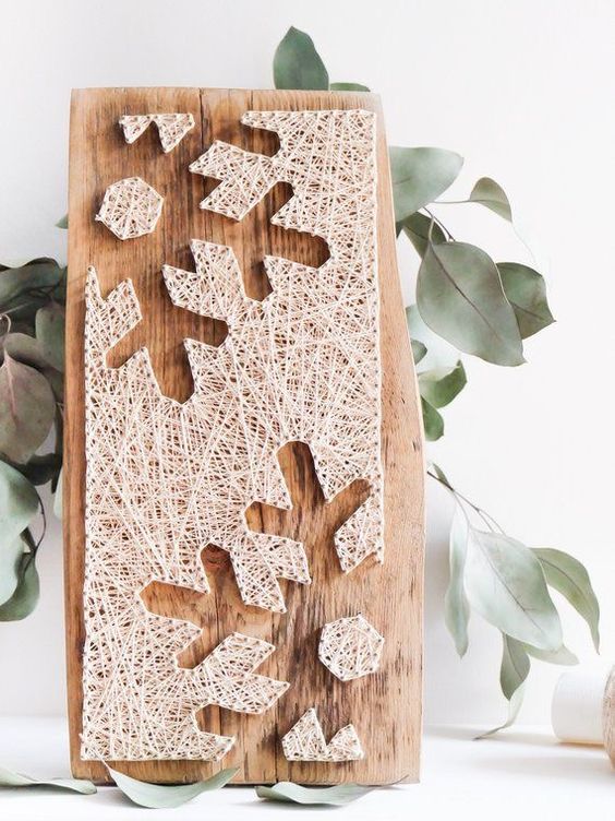 a beautiful and non-typical Christmas string art piece with snowflakes is adorable, it can be used for winter, too