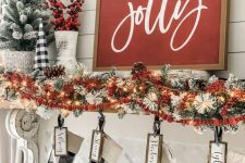 a classic red Christmas sign with white calligraphy is always a good idea for most of farmhouse-inspried interiors
