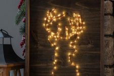 a fantastic lit up Christmas deer sign composed of lights instead of strings is a lovely decor idea for the holidays
