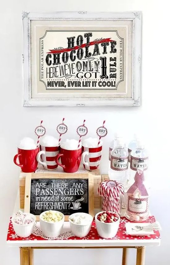 a gorgeous festive hot chocolate station with sweets done in traditional red and white