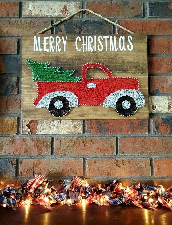 a gorgeous red lorry with a Christmas tree string art for a funny touch, it looks bright and very holiday-inspired