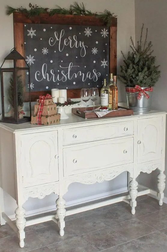a large chalkboard sign in a stained frame is a great idea for any space to style it for Christmas