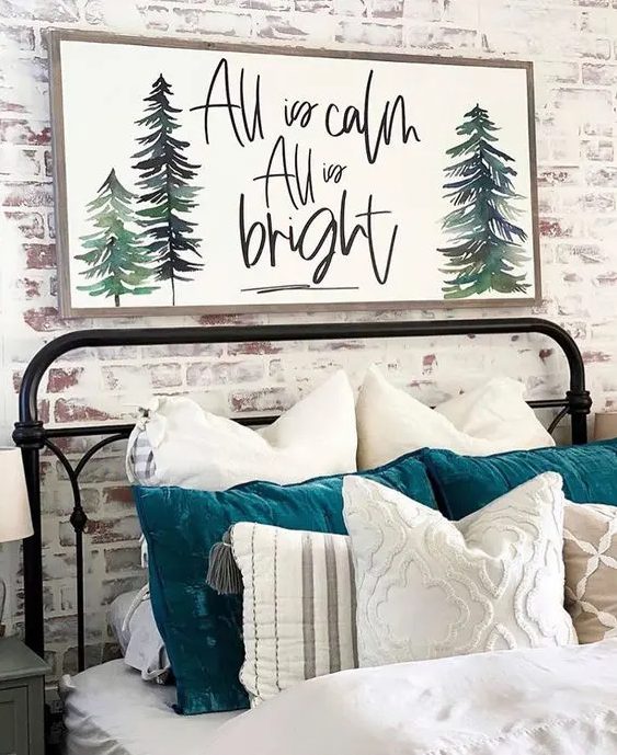 a simple and cool farmhouse Christmas sign with calligraphy and painted Christmas trees is all cool