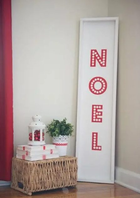 a simple and laconic red and white Christmas sign with letters is a lovely decor idea for the holidays