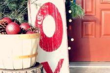 a tall red and white Christmas sign with red letters is a cool idea for outdoors, it will bring a lovely vintage touch to the space