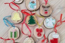 adorable Christmas tree ornaments of branch slices and string art on them are amazing for styling a tree