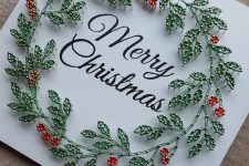 an elegant Christmas string art piece with calligraphy and strign art leaves and berries is wow