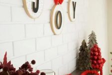 hoops with letters and red bows and ribbons are an amazing wall decoration for Christmas