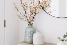 patterned neutral vases with branches and blooms for simple Nordic decor