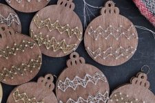plywood Christmas ornaments with string art decor are amazing for Christmas trees in rustic style