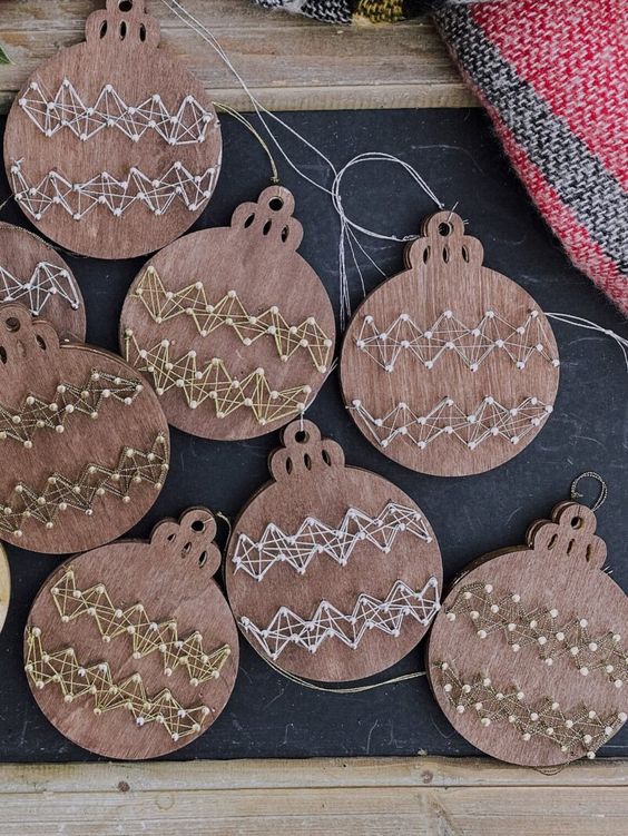 plywood Christmas ornaments with string art decor are amazing for Christmas trees in rustic style