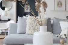 simple Scandinavian fall decor with a white vase and dried grass is a lovely and simple solution for the fall