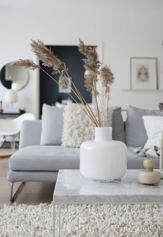 simple Scandinavian fall decor with a white vase and dried grass is a lovely and simple solution for the fall