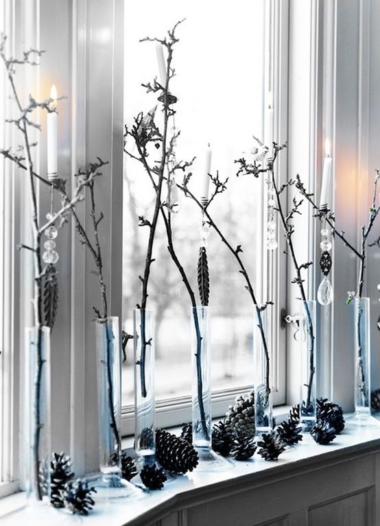simple window decor with pinecones, branches in vases and crystals hanging on them