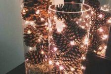 tall glass vases filled with pinecones and LEDs will bring a rustic yet modern touch to your space