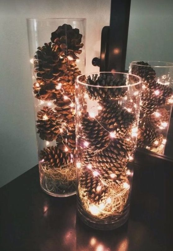 tall glass vases filled with pinecones and LEDs will bring a rustic yet modern touch to your space