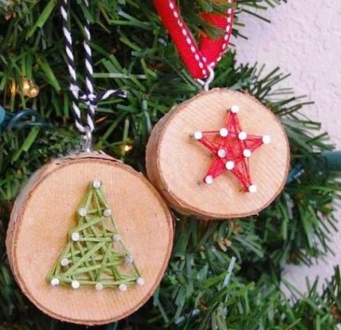 wood slice Christmas ornaments with string art decor, which is a hot trend right now