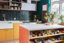09 a colorful eclectic kitchen with emerald walls, a dark green chevron tile backsplash, bold cabinets and open shelves