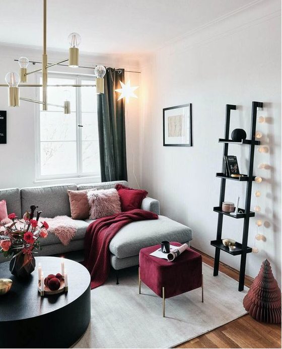 A glam chandelier, a garland of lights and a bold star shaped hanging lamp for illuminating the space