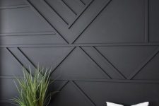 37 a black paneled accent wall is a great statement in your living room or bedroom, it will texture