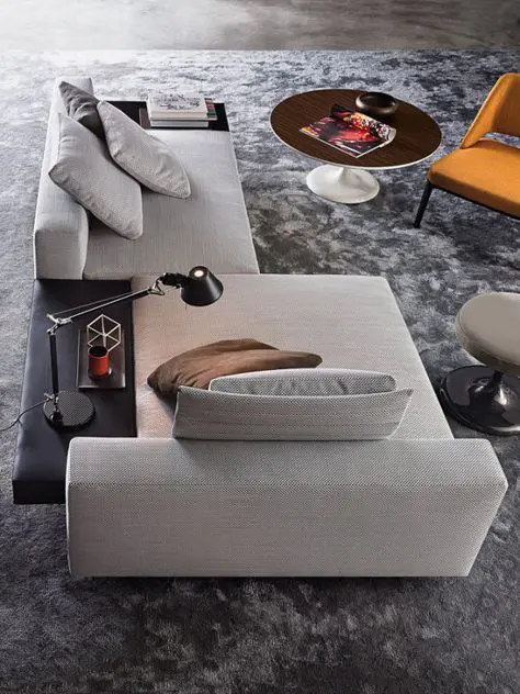 a cool neutral sofa that can be positioned as you need, with a black side table for more comfort