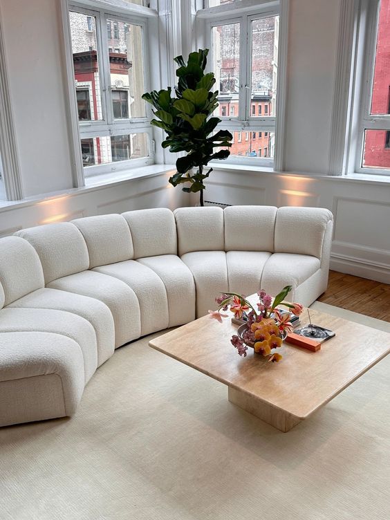 A curved modular sofa in boucle is a gorgeous idea as it includes three trends   curves, flexibility and boucle