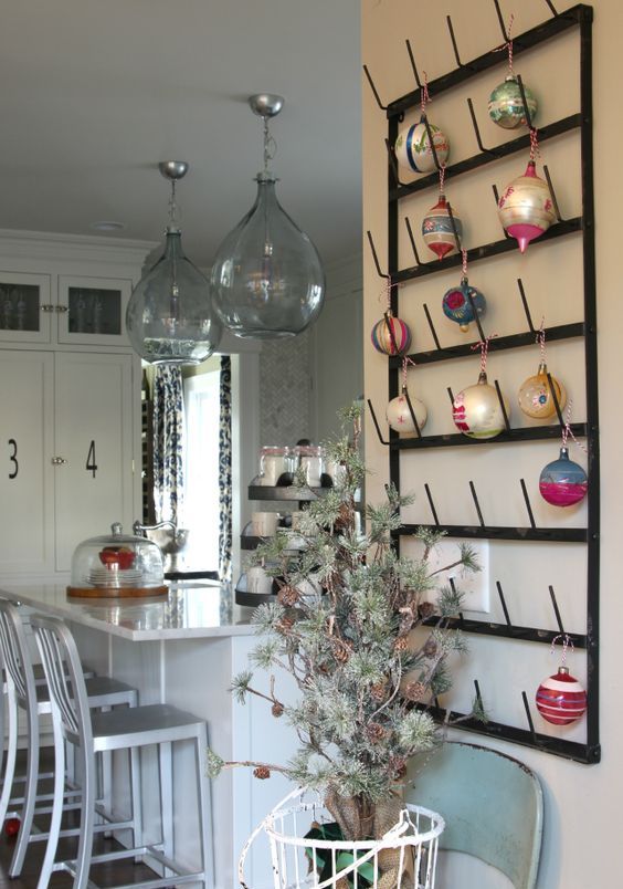 a metal rack used for displaying your Christmas ornaments is a very creative and cool idea for the holidays