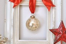 a minimalist christmas wreath made of a frame and an ornament