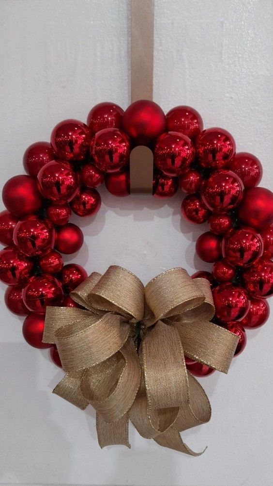 a timeless red ornament Christmas wreath with a burlap bow is always a good idea as it's very traditional