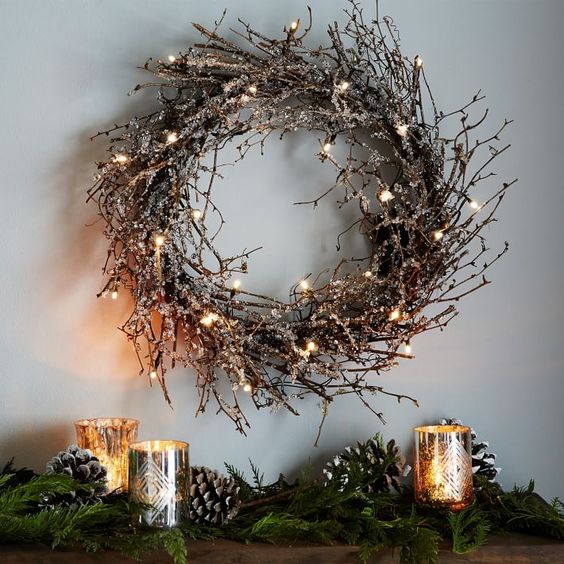 a twig Christmas wreath with lights is a cool rustic decoration for the holidays