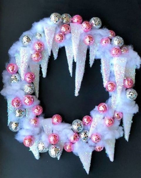 a unique icicle Christmas wreath with silver and pink disco balls is a super catchy decor idea