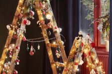 ladders covered with lights, with red, white and green ornaments and snowflakes can be alternative to usual Christmas trees
