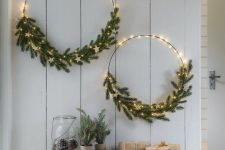 simple and lovely holiday wreaths with lights, evergreens and white stars are amazing for Christmas
