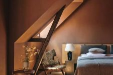 a stylish terra cotta attic bedroom